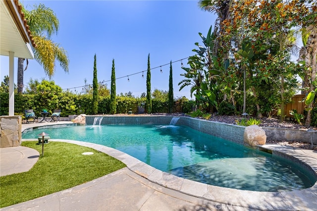 view of swimming pool with pool water feature