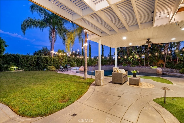 yard at dusk with a patio, a pergola, and ceiling fan