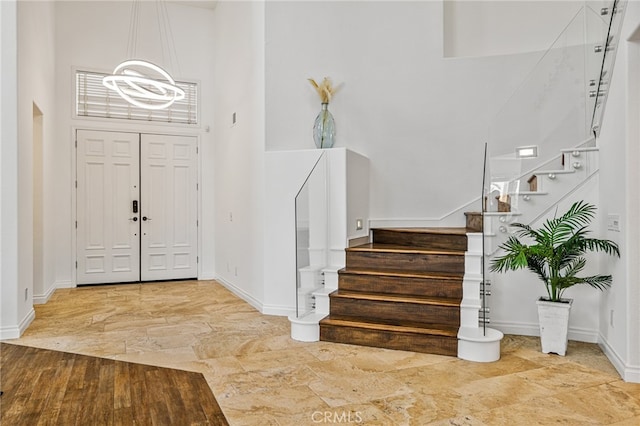 foyer with a towering ceiling