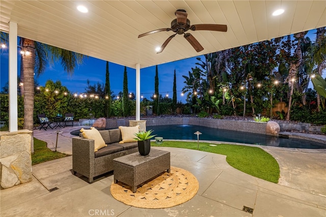 patio terrace at dusk with pool water feature and ceiling fan