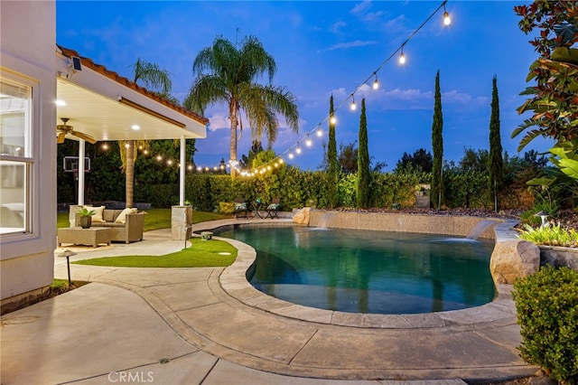 pool at dusk with a patio, outdoor lounge area, and pool water feature