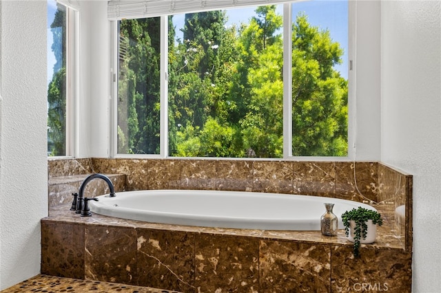 bathroom with tiled bath