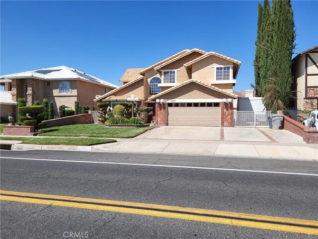 view of front of home featuring a front yard and a garage