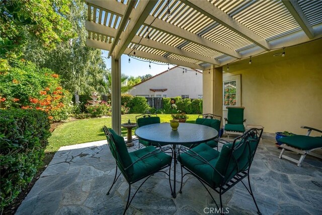 view of patio featuring a pergola