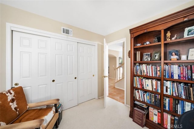 living area with light colored carpet