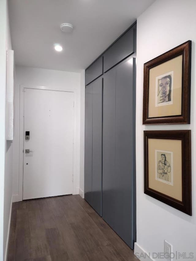 corridor featuring dark hardwood / wood-style flooring