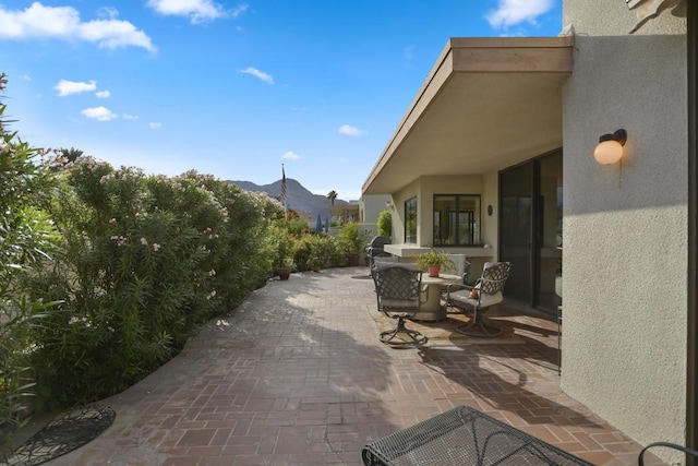 view of patio featuring a mountain view