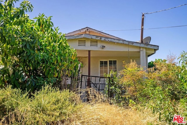 view of home's exterior featuring a porch