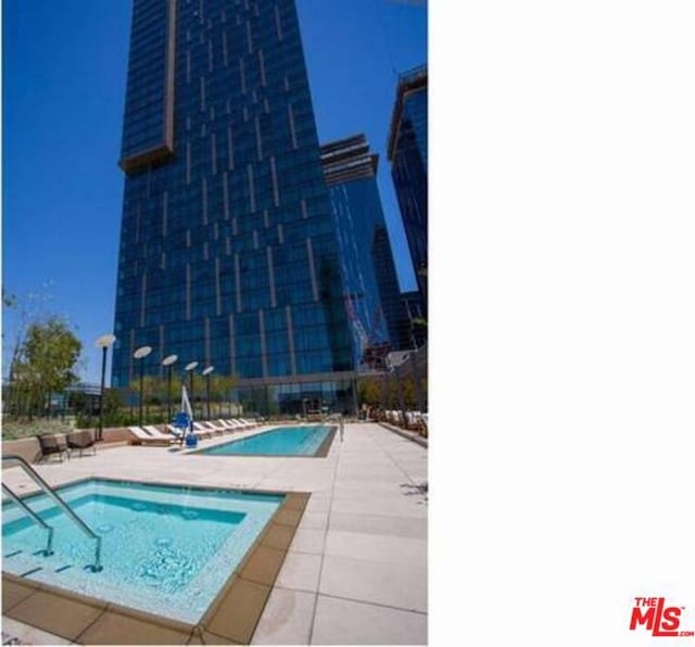 view of swimming pool featuring a patio area