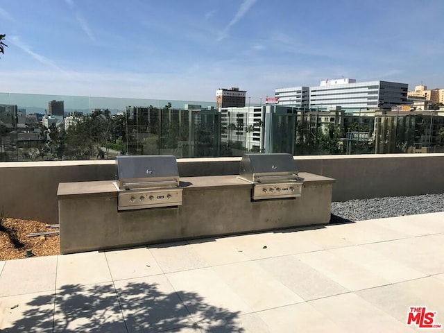 view of patio featuring grilling area and exterior kitchen