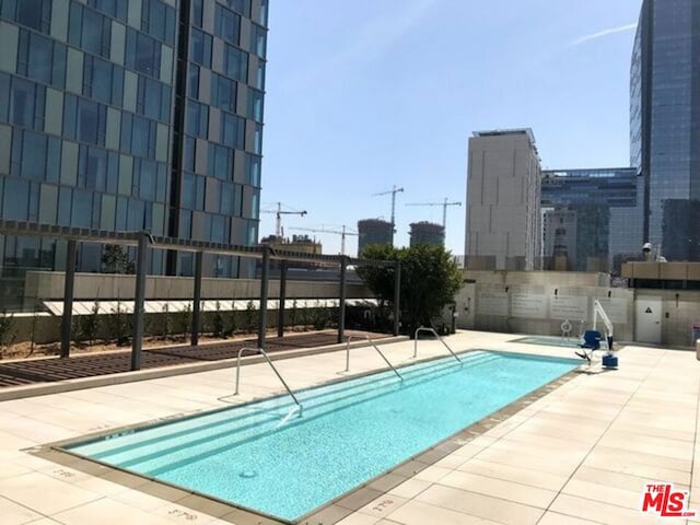 view of pool featuring a patio area