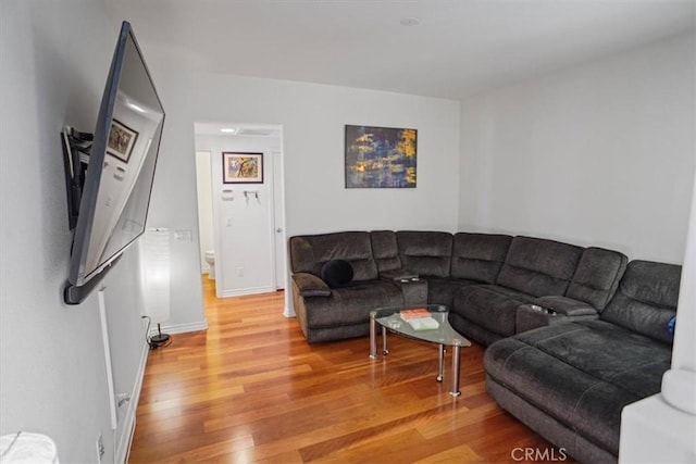 living room with light hardwood / wood-style flooring