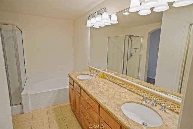 bathroom featuring tile patterned floors, separate shower and tub, and vanity