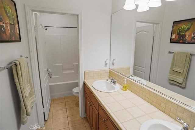 full bathroom featuring tile patterned floors, vanity, tub / shower combination, and toilet