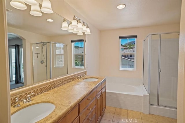 bathroom featuring separate shower and tub, tile patterned flooring, and vanity