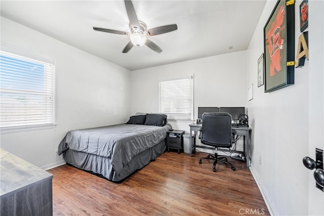 bedroom featuring hardwood / wood-style flooring and ceiling fan