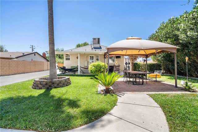 surrounding community with a patio area, a gazebo, and a lawn