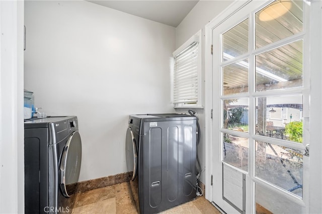 clothes washing area with washer and dryer