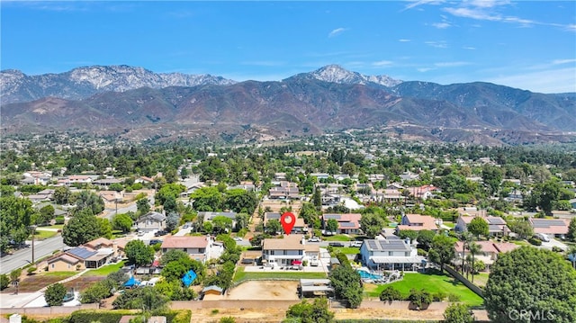 birds eye view of property with a mountain view