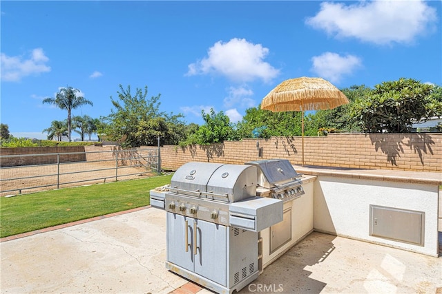 view of patio featuring exterior kitchen and area for grilling