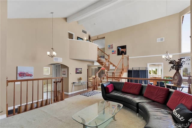 living room with beamed ceiling, an inviting chandelier, high vaulted ceiling, and hardwood / wood-style flooring