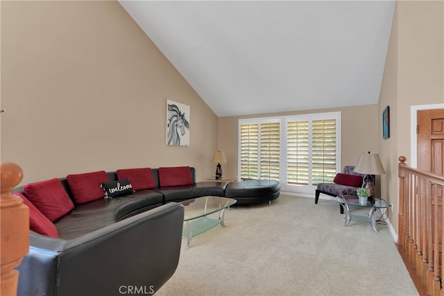 living room featuring carpet floors and high vaulted ceiling