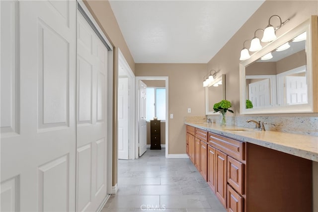 bathroom featuring tile patterned flooring and vanity