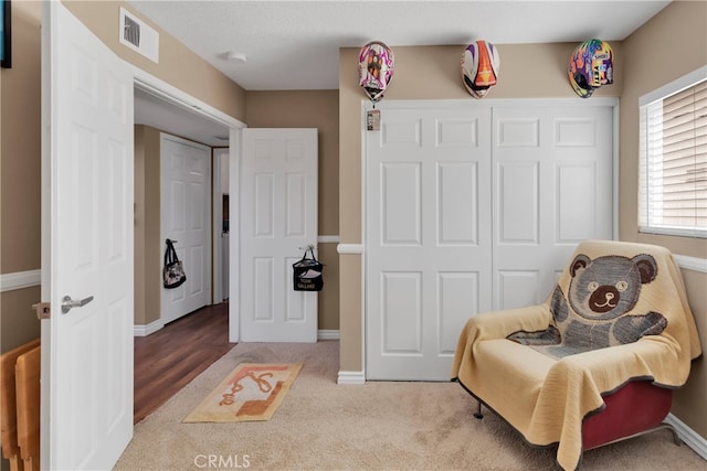 living area featuring hardwood / wood-style flooring