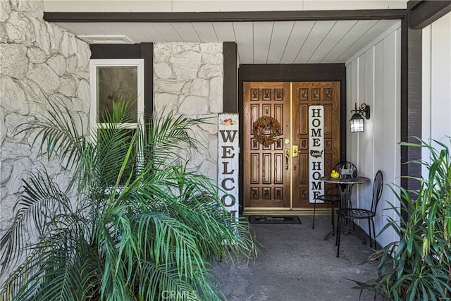 doorway to property featuring a porch