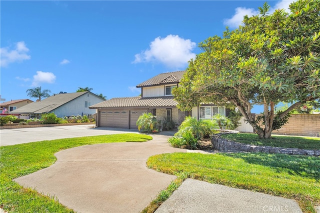 view of front of house featuring a garage and a front yard