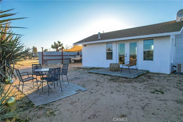 back of house with a patio and central AC