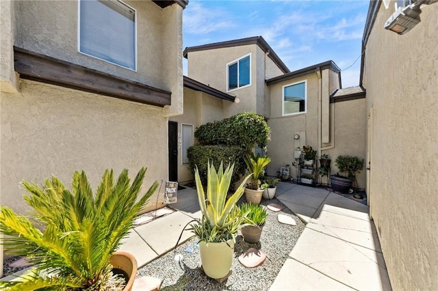 property entrance with a patio