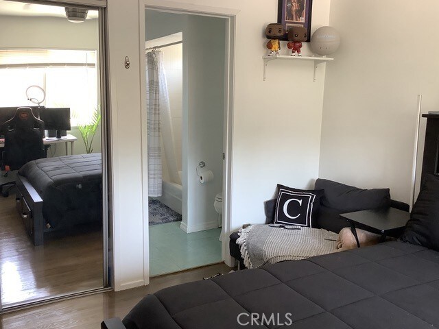 bedroom featuring hardwood / wood-style floors