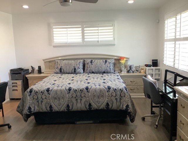 bedroom featuring light wood-type flooring and ceiling fan