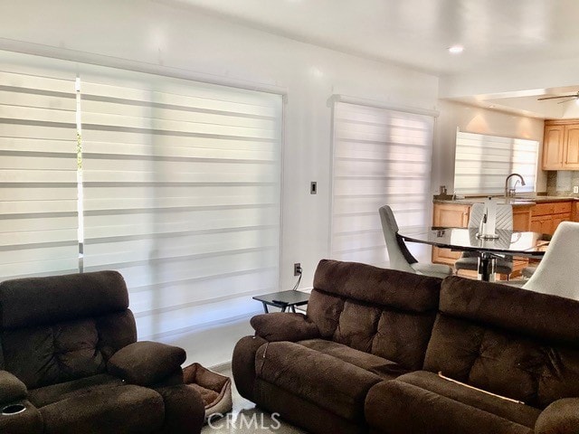 living room featuring ceiling fan