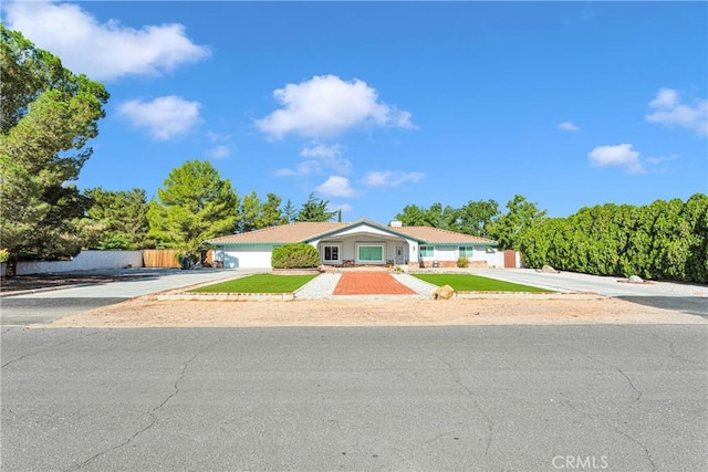 single story home featuring a garage