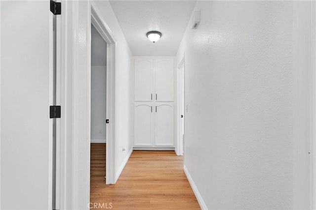 hallway featuring light hardwood / wood-style floors