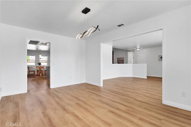 unfurnished dining area featuring light hardwood / wood-style flooring