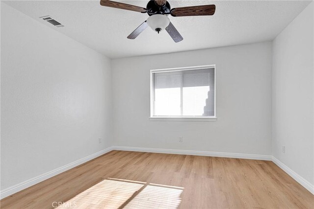 unfurnished room with light hardwood / wood-style flooring and ceiling fan