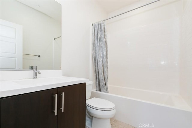 full bathroom featuring tile patterned floors, vanity, toilet, and shower / bath combo with shower curtain