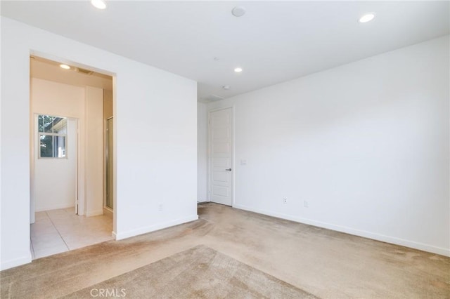 empty room with light colored carpet