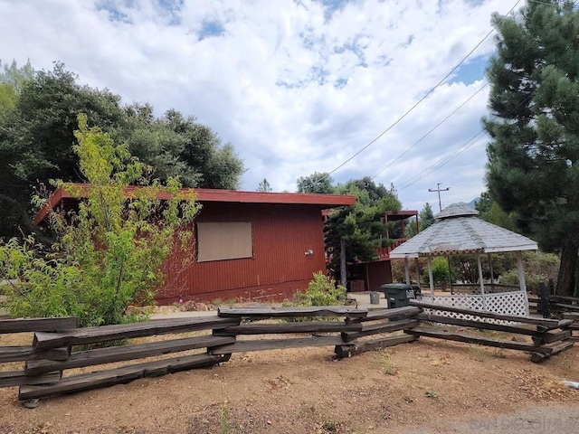 view of home's exterior featuring a gazebo