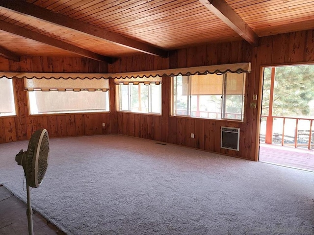 unfurnished sunroom with wooden ceiling, heating unit, and beam ceiling