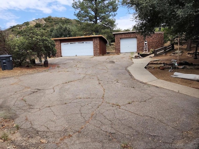 exterior space featuring a garage and an outdoor structure