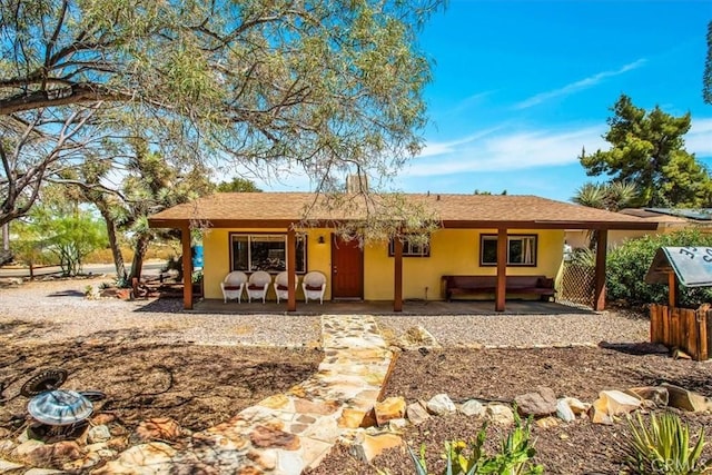 rear view of property featuring a patio