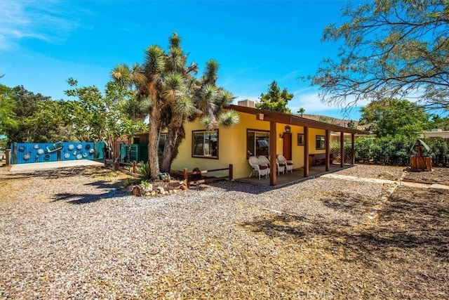 back of property featuring a patio area