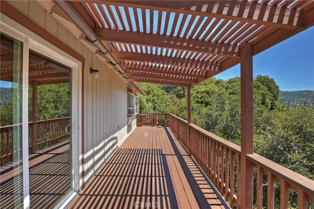 wooden deck featuring a pergola