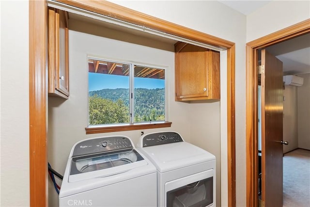 laundry room with cabinets, separate washer and dryer, an AC wall unit, a mountain view, and carpet floors