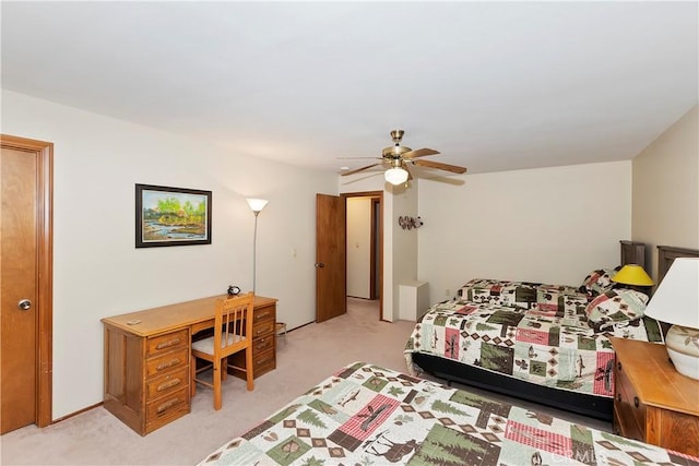 bedroom featuring ceiling fan and light carpet