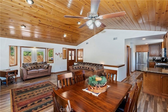 dining room with wood-type flooring, wood ceiling, high vaulted ceiling, and french doors